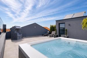 a swimming pool on the roof of a house at Palheiro 81 in Costa Nova