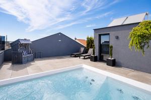 a swimming pool on the roof of a house at Palheiro 81 in Costa Nova