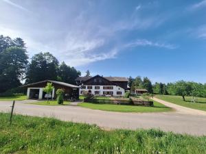 a house on the side of a road at Chambres d'hôtes Les Fontaines in Tramelan +2 photos