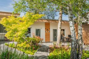 a home with a patio and trees at Green Village Igelnest in Benz
