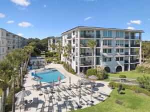 an aerial view of a resort with a pool and buildings at North Breakers - Unit 202, Wood Ave in East End