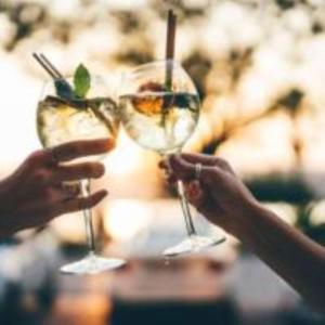 two people are holding up glasses at Hôtel de Charme By Arts & Millésimes in Essoyes