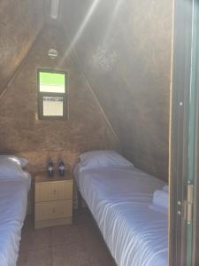two beds in a small room with a window at Valbom by Campigir in Sesimbra +36 photos