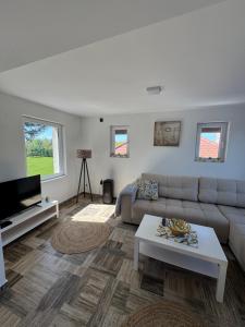 a living room with a couch and a table at Hedona227 in Perlez