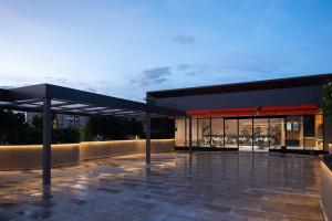 a large building with a large glass window at Orchid Parc Bengaluru - Manyata Business Park in Bangalore