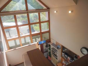 an overhead view of a room with a large window at ペンションBell in Fujimi +54 photos