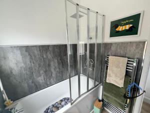 a shower with a glass enclosure in a bathroom at 28 Victoria Terrace, Bedlington, ground floor in Bedlington