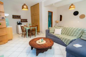 a living room with a couch and a table at Nesto Living in Chóra
