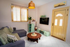 a living room with a couch and a table at Nesto Living in Chóra
