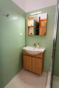 a bathroom with a sink and a mirror at Nesto Living in Chóra +22 photos