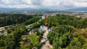 an aerial view of a park with a large red arrow at Park Hotel Żywiec in Żywiec