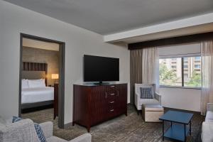 a hotel room with a bed and a flat screen tv at DoubleTree by Hilton Hotel Flagstaff in Flagstaff
