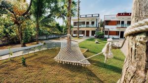 a hammock in the yard of a house at Zenways in Varkala