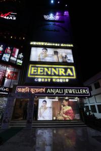 a building with a sign for a theater at night at Eennra Guest House in Mālda