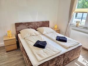 a bedroom with two beds with towels on them at Nicos Ferienwohnung in Grevesmühlen - ABC628 in Grevesmühlen