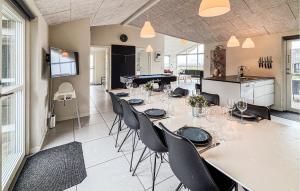 a large dining room with a table and chairs at Nice Home In Haderslev With Sauna in Haderslev