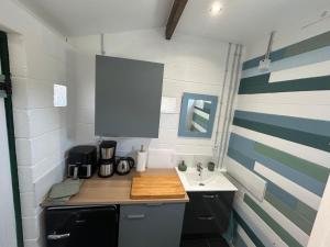 a small kitchen with a counter and a sink at The yurt at Gites 474 in Sallèles-dʼAude