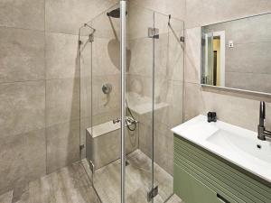 a bathroom with a shower and a sink at Design & Balcony In City Center By Feelhome in Tel Aviv