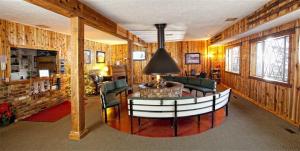 a living room with a couch and a table and chairs at Chateau Apres Lodge in Park City