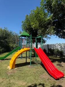 a playground with a colorful slide in a park at Las moras quinta in San Nicolás de los Arroyos