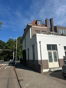 a building on the corner of a street at The Velvet Suite Alkmaar in Alkmaar