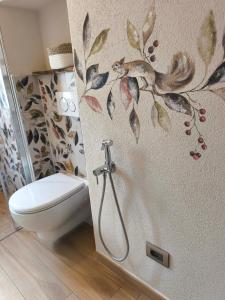 a bathroom with a toilet and a shower stall at Lu Cheur ad Zona Verde in Limone Piemonte +15 photos
