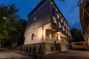 a building with lights on the side of it at TAU 28 Hotel in Almaty