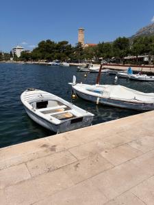 a group of boats docked in a body of water at Katarina in Kaštela
