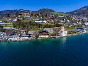 an aerial view of a town next to the water at Villa Alti Ländte in Oberhofen am Thunersee