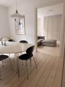 a living room with a dining room table and chairs at Hearthstone Atelier in Antwerp