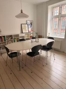 a dining room table and chairs in a room at Hearthstone Atelier in Antwerp