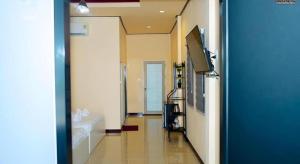 a hallway of a bathroom with a tub and a sink at Limlay House in Ban Suan On +28 photos