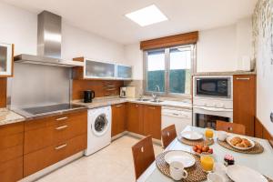 a kitchen with a table with a plate of food at Casa Turística la Almunia in Castellanos de Moriscos