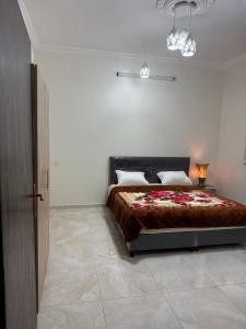 a bedroom with a bed in a white room at اطلال الهدا Al-Hada ruins in Taif