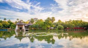 a pond with a house in the middle of it at E Moon Hotel in Taichung