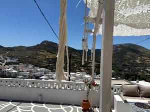 a balcony with a view of a city at Vasiliki Skyros Castle View in Skiros