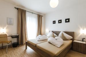 Voodi või voodid majutusasutuse Pension Julia & Haus Elisabeth - Wallner's Hofheuriger & Weinhof toas