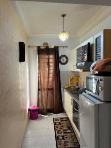 a kitchen with a sink and a refrigerator at dreams beach city in Sousse
