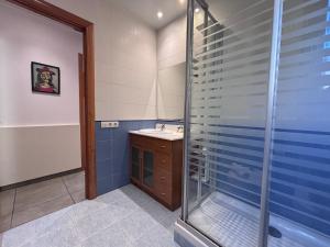 a bathroom with a shower and a sink at Private Terrace House near Camp Nou in Hospitalet de Llobregat +14 photos