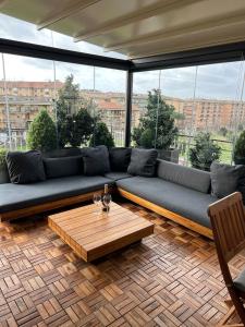 a living room with a couch and a coffee table at Fiorucci Apartments - Veronica's House in Rome +6 photos
