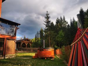a yard with a house and a gazebo at Villa Golful Verde in Colibiţa