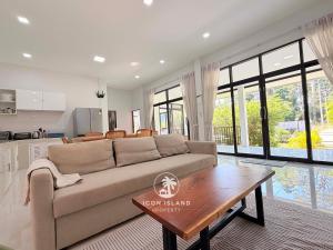 a living room with a couch and a table at Villa La Forest Koh Phangan in Ko Phangan