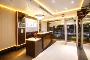 a lobby of a salon with a counter and a window at Hotel Delhi 37 by Star Group in New Delhi