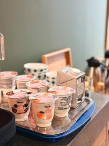 a tray filled with cups of ice cream on a counter at Hotel Damsquare in Amsterdam
