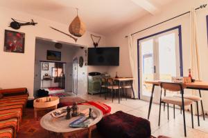 a living room with a couch and a table at Ifni Sunset in Sidi Ifni