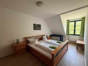 a bedroom with a large bed in a room at Spreewälder Feriendomizil/Pension in Burg
