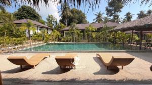 a swimming pool in front of a house at Villa La Forest Koh Phangan in Ko Phangan