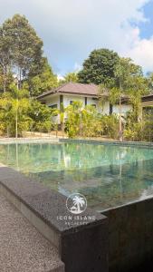 a swimming pool in front of a house at Villa La Forest Koh Phangan in Ko Phangan