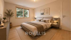 a bedroom with a large bed and a window at Panorama Apartment Ried-Brig in Ried-Brig