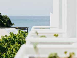 a view of the ocean from the balcony of a resort at Elysium Noosa Resort - MGallery Collection in Noosa Heads +67 photos